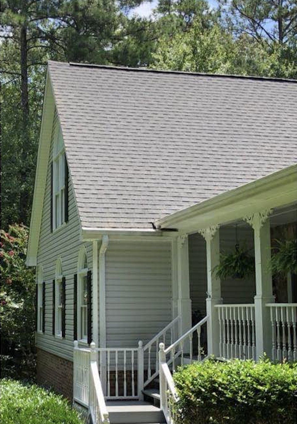 After: Roof soft washing before and after showing moss and algae removal